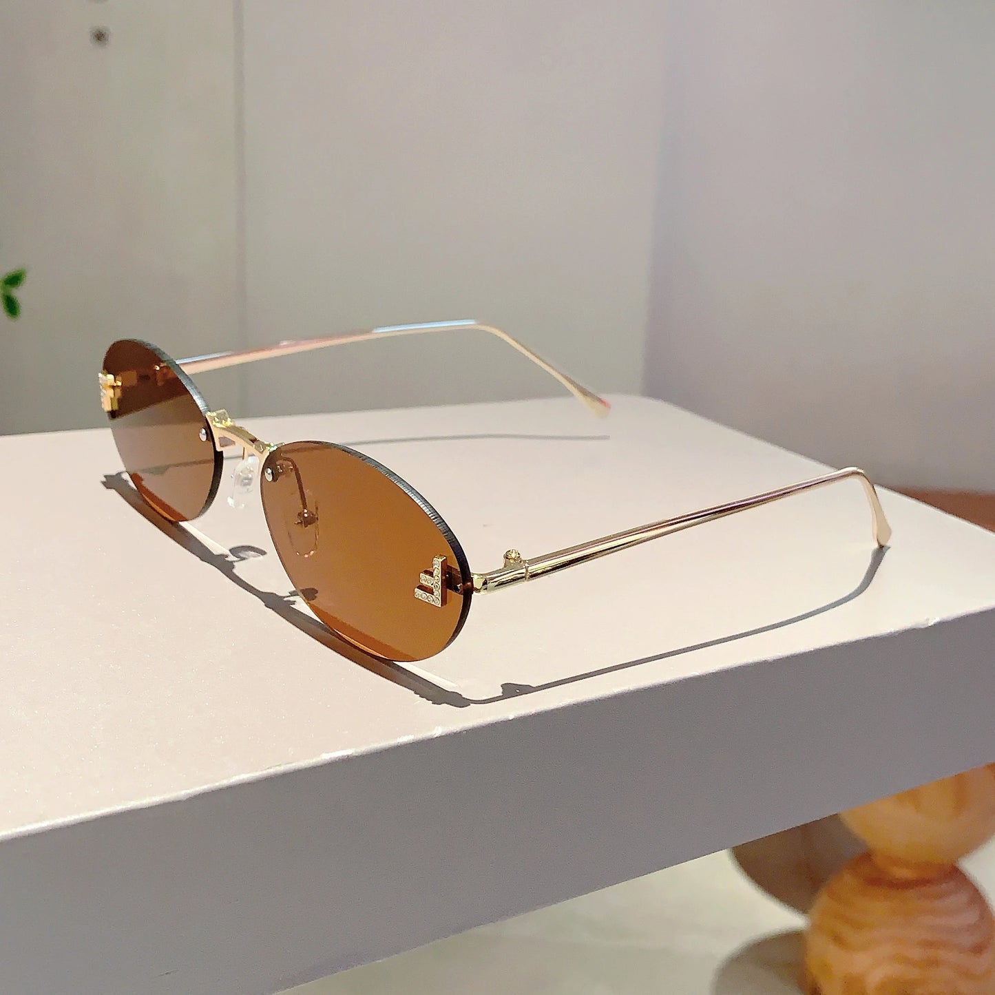 Rose Rimless Oval Sunglasses