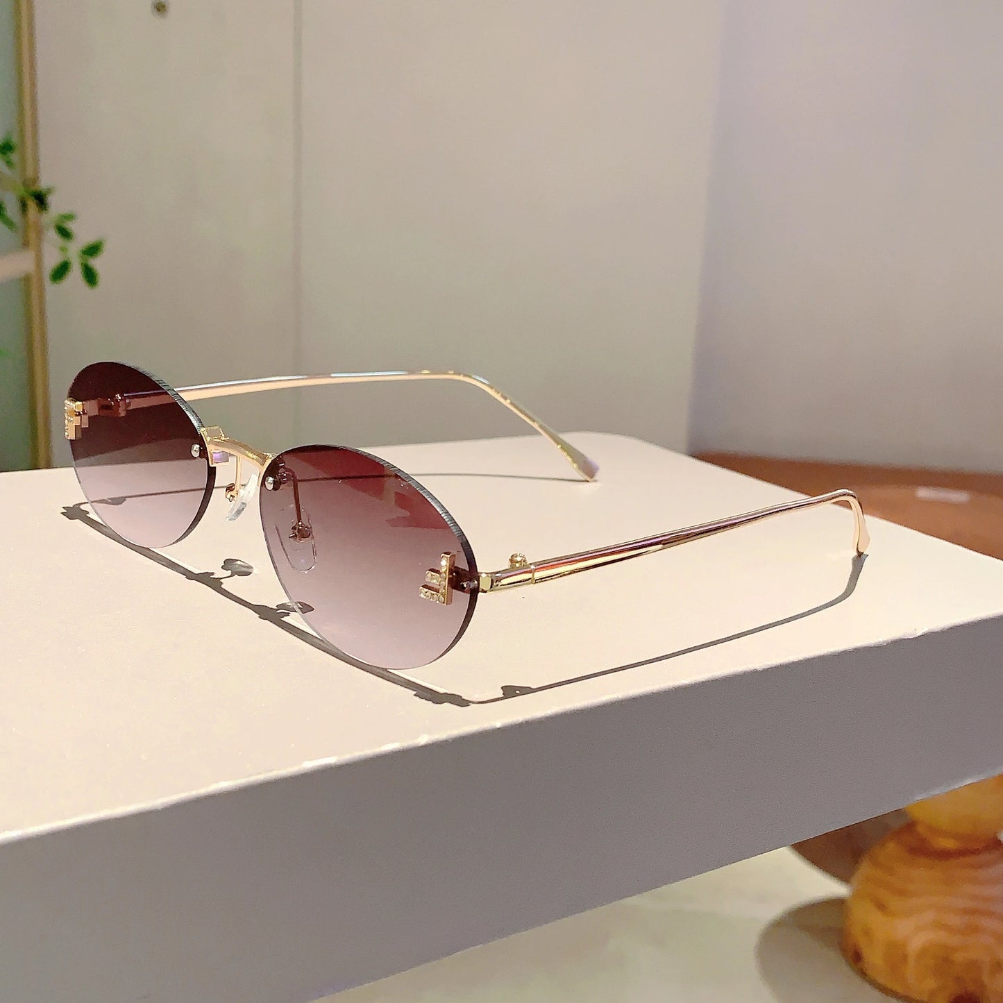 Rose Rimless Oval Sunglasses